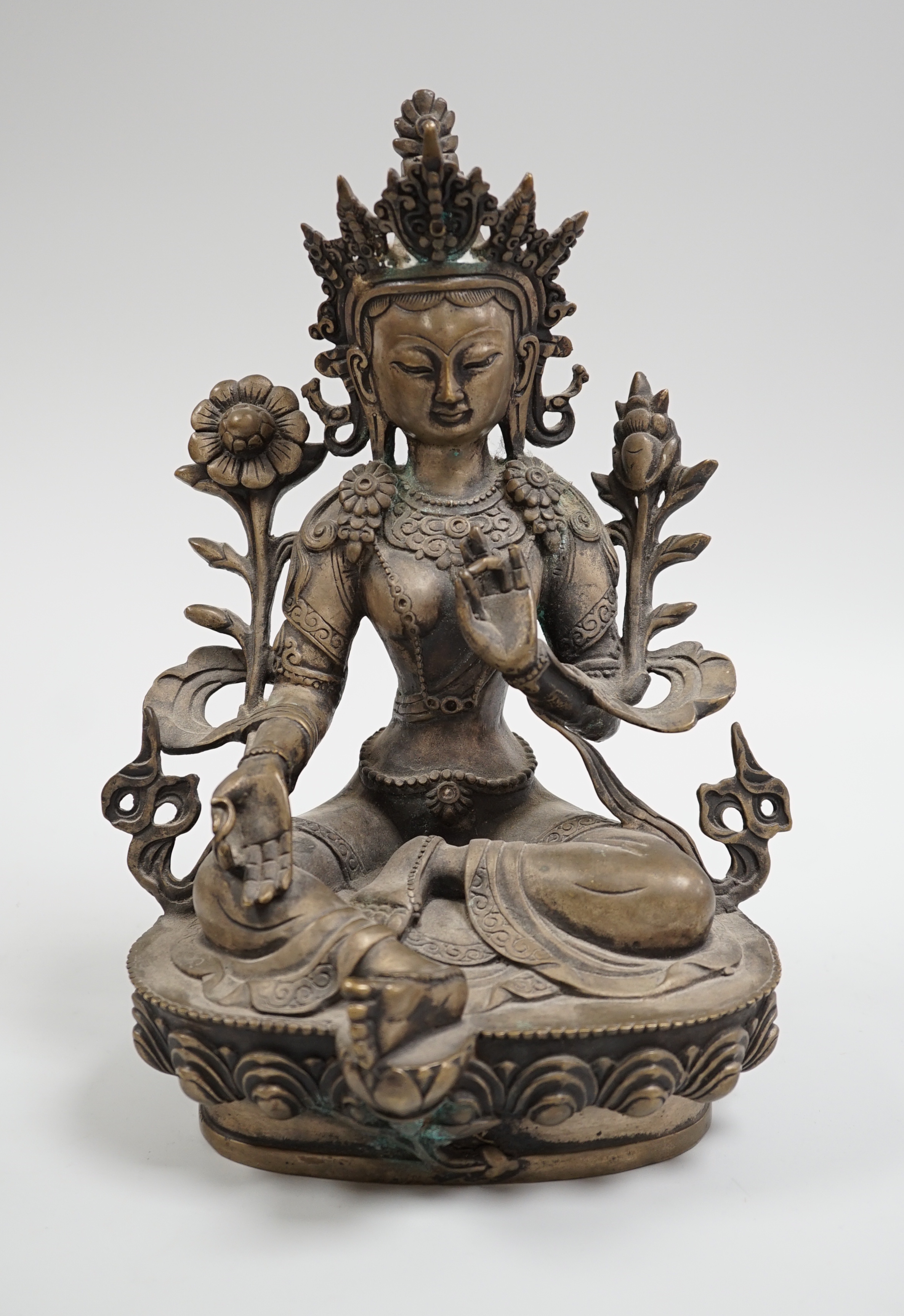 A Himalayan bronze seated figure of Green Tara, 29cm tall